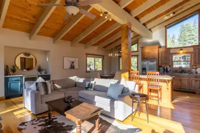 a living room with a couch and a table at Kings Beach Family Retreat - Lake Views and Hot Tub in Kings Beach