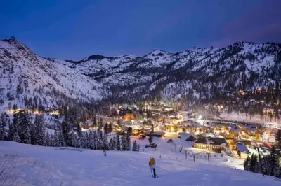 a ski resort in the snow at night at Charming Kings Beach Cabin, Hot Tub, Walk to Lake in Kings Beach