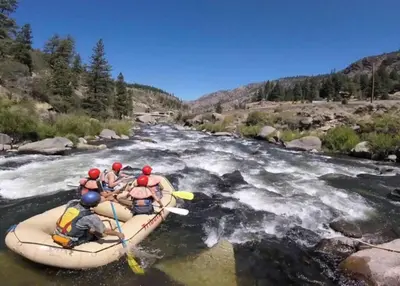 a group of people in a raft on a river at Charming Kings Beach Cabin, Hot Tub, Walk to Lake in Kings Beach