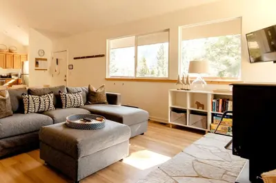 a living room with a couch and a chair at Walk to Palisades Village Pet Friendly 2BR Chalet in Olympic Valley