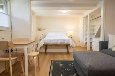 a bedroom with a bed and a table and a desk at Welcoming Studio Walk to Palisades Resort and Lifts in Olympic Valley
