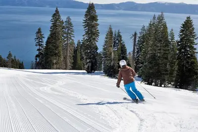 a person is skiing down a snow covered slope at Walk to Lake West Shore Cabin Hot Tub DogOK EVplug in Homewood