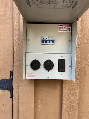 a electrical box on the side of a wall at Walk to Lake West Shore Cabin Hot Tub DogOK EVplug in Homewood