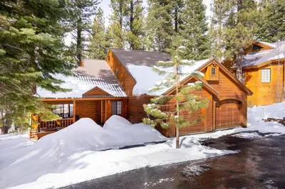 a log cabin in the woods in the snow at Family Escape Minutes to Northstar EV Charger WandD in Truckee