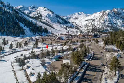 an aerial view of a ski resort with snow covered mountains at Serene Condo by Palisades Base and Golf Course in Olympic Valley