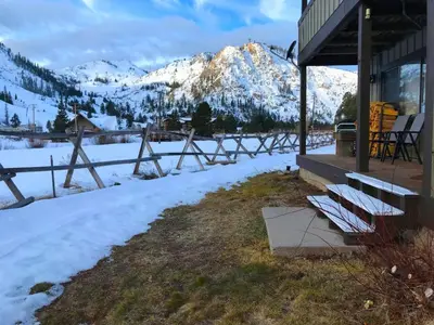 a group of benches in the snow next to a building at Serene Condo by Palisades Base and Golf Course in Olympic Valley