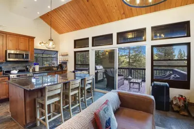 a kitchen with a bar and a couch in a room at Idyllic Incline Village close to Lake Tahoe in Incline Village
