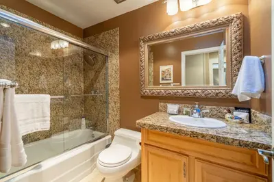 a bathroom with a toilet and a sink and a bath tub at Tranquil Stay Sauna, Rooftop and Nature Views in Incline Village