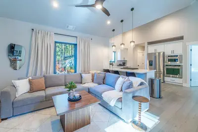 a living room with a couch and a table at Elegant Tahoe Escape Comfort and Style Combined in Glenbrook