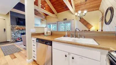 a kitchen with a sink and a mirror at Bigwood #30 condo in Mammoth Lakes