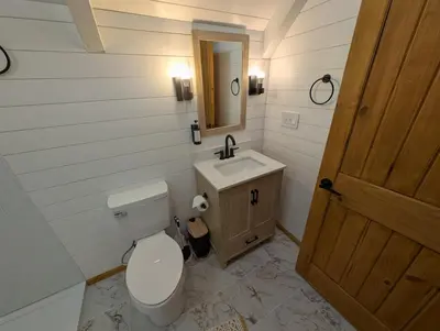 a bathroom with a toilet and a sink at Mountain Haven Near Kirkwood Resort! in Pioneer