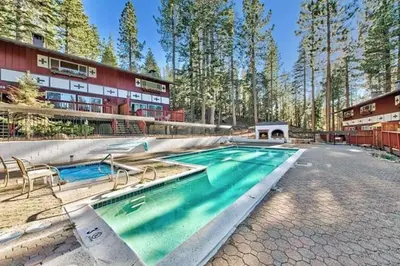 a swimming pool in front of a building at 1510 Wildwood, Sitzmark 4 home in South Lake Tahoe
