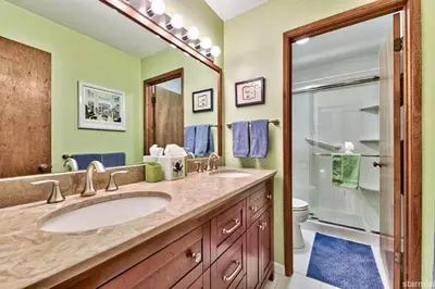 a bathroom with a sink and a shower and a toilet at 1510 Wildwood, Sitzmark 4 home in South Lake Tahoe