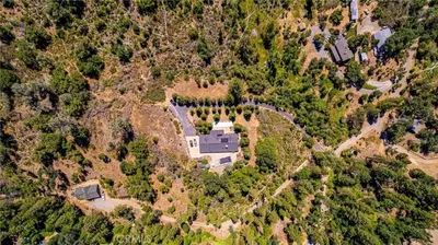 an aerial view of a house on a mountain at Scenic Mountain Views w Heated Pool, Game Room, and Hottubs in Oakhurst