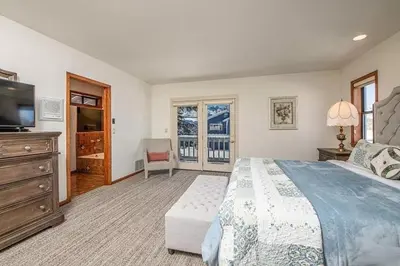 a bedroom with a large bed and a television at 625 Alpine Drive home in South Lake Tahoe