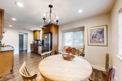 a kitchen and dining room with a table and chairs at Meadows Crossings in South Lake Tahoe