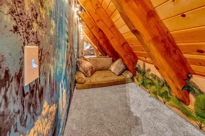 a room in a cabin with a couch in it at Homewood Hideaway Family Friendly plus EV Charger in Homewood