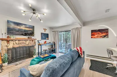 a living room with a couch and a fireplace at Modern Incline Village Escape Near Lake and Trails in Incline Village