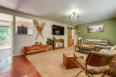 a living room with a couch and a table at Hike and Ski! Cabin 20 Mi to Soda Springs Mtn Resort in Emigrant Gap
