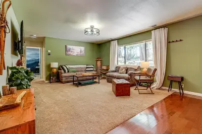 a living room with a couch and a table at Hike and Ski! Cabin 20 Mi to Soda Springs Mtn Resort in Emigrant Gap