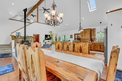 a dining room and kitchen with a table and chairs at New Listing! North Fork Hideaway Sleeps 14! in Three Rivers