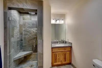 a bathroom with a sink and a shower at Tall Pine Chalet home in Stateline