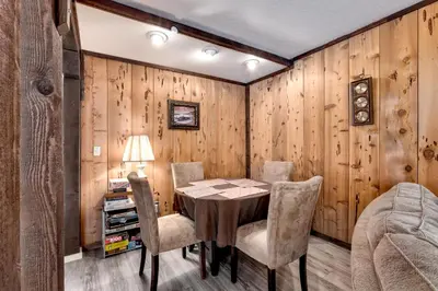 a dining room with a table and chairs at Snowflake Chalet condo in Stateline