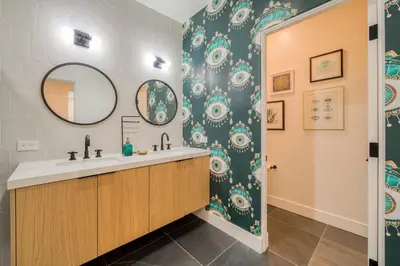 a bathroom with a sink and a mirror at Twilight Run at Palisades by Tahoe Getaways - Pet-Friendly 3BR w EV Charger & Ski Shuttle in Olympic Valley
