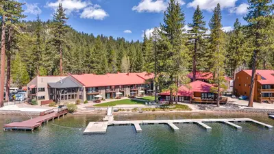 an image of a resort with a dock in the water at Beautiful Studio W/Kitchenette #134 at Donner Lake Village in Truckee