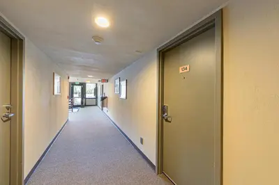 an empty hallway with two doors in a building at Beautiful Studio W/Kitchenette #134 at Donner Lake Village in Truckee