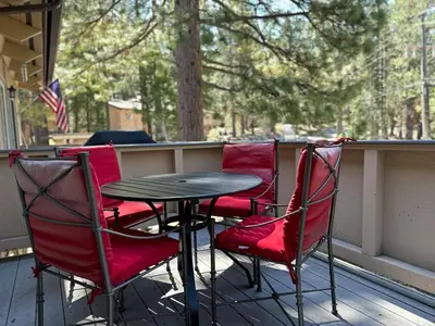 a table and four chairs on a porch at Tahoe Townhome-Lake-Beach-Pool-Amenities in Incline Village