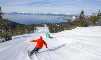 two people are skiing down a snow covered slope at Tahoe Townhome-Lake-Beach-Pool-Amenities in Incline Village