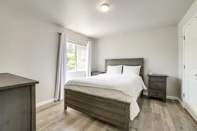 a bedroom with a large bed and a window at 3 Mi to Dtwn Gated Condo with Patio in Reno! in Reno