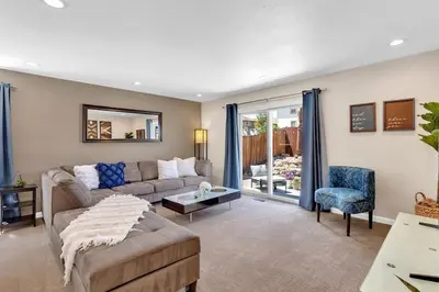 a living room with a couch and a chair at Reno Retreat-Near Downtown-UNR-Family Fun in Reno