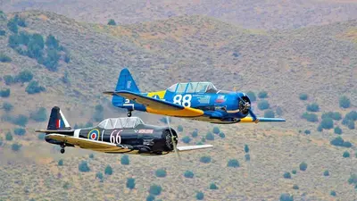 two planes are flying in the sky at Reno Retreat-Near Downtown-UNR-Family Fun in Reno