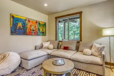 a living room with a couch and a table at The Lodge at Silverado in Tahoe City