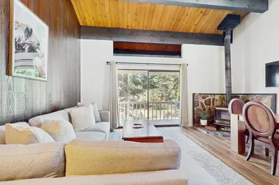 a living room with a couch and a table at Cozy Bear Retreat in Kings Beach