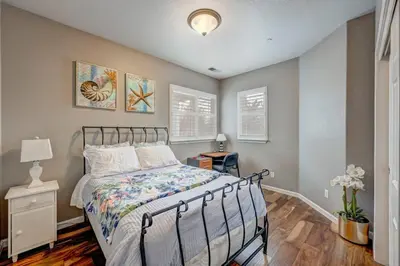 a bedroom with a bed and a lamp on a table at Marina Escape-Lake-Family-Fishing-Casino in Sparks