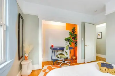 a bedroom with a bed and a desk at Midtown Oasis w BBQ Deck Games and Artistic Vibes in Sacramento