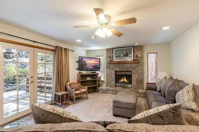 a living room with a couch and a fireplace at Silver Rock Lodge home in Zephyr Cove