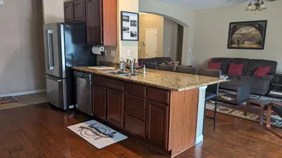 a kitchen with a counter top and a refrigerator at Tanglewood Place in Visalia