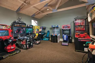 a room filled with arcade games and video games at Wyndham Angels Camp 1BR Apartment with Resort Access in Angels Camp