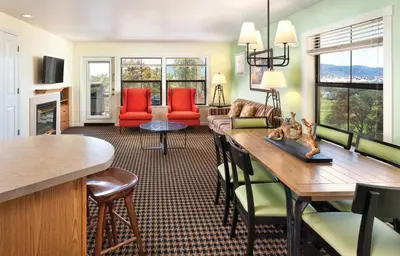 a kitchen and living room with a dining room at Wyndham Angels Camp 1BR Apartment with Resort Access in Angels Camp