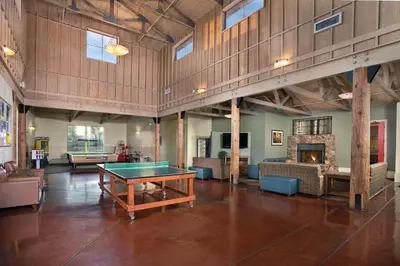 a large room with a ping pong table in it at Wyndham Angels Camp 2BR Apartment with Resort Access in Angels Camp