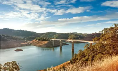 a bridge over a body of water at Wyndham Angels Camp 2BR Apartment with Resort Access in Angels Camp