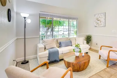 a living room with a couch and a table at Clovis Family Home Private Pool, Near Old Town! in Clovis