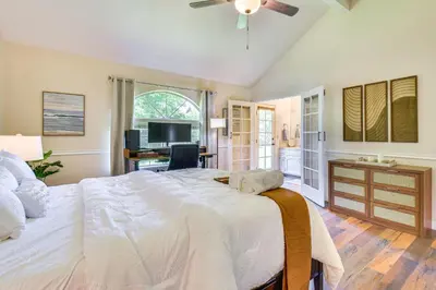 a bedroom with a large white bed and a desk at Clovis Family Home Private Pool, Near Old Town! in Clovis