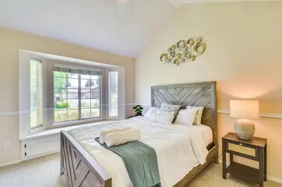 a bedroom with a large bed and a window at Clovis Family Home Private Pool, Near Old Town! in Clovis