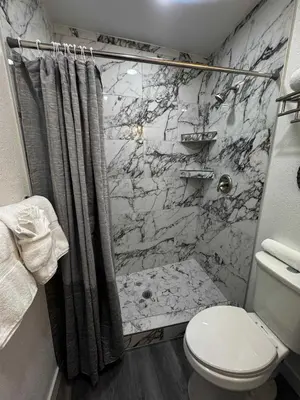 a bathroom with a shower and a toilet at #9 Lakeside Location Beach Access View BalconyDog in Kings Beach