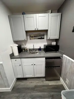 a kitchen with white cabinets and a sink at #10 Lakeside Great Location Beach Access Dogs ok in Kings Beach